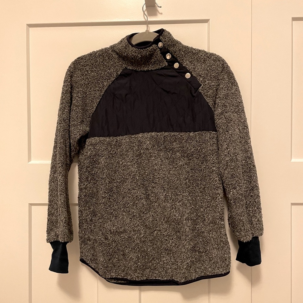 Fuzzy sweatshirt with asymmetrical neck